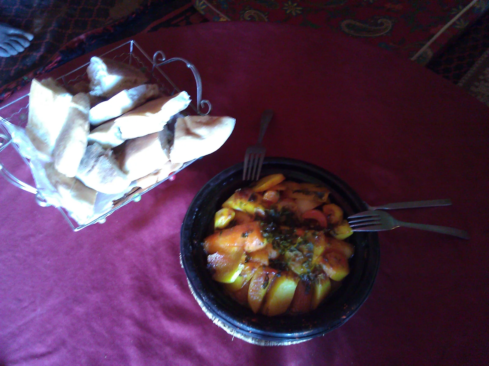 A Moroccan tagine cooking in its clay pot